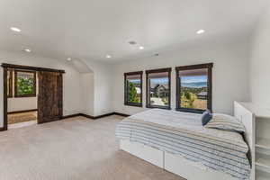Bedroom featuring light colored carpet and recessed lighting