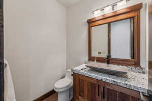 Bathroom featuring vanity and wood finished floors