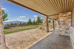View of patio / terrace featuring a mountain view