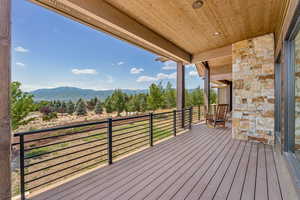 Wooden terrace featuring a mountain view