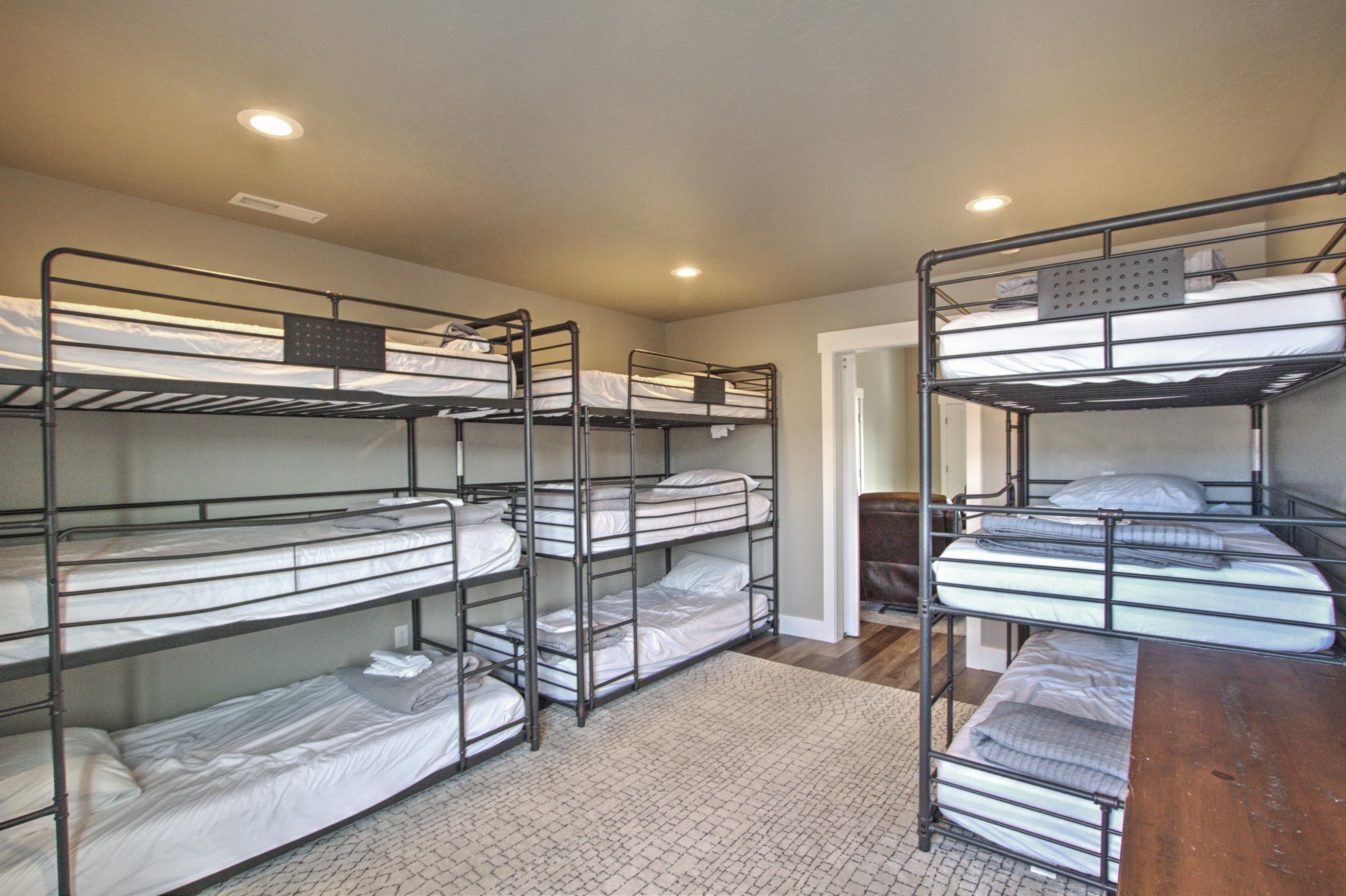 Bedroom with wood finished floors, recessed lighting, visible vents, and baseboards