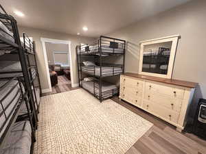 Bedroom featuring recessed lighting, dark wood-type flooring, and baseboards
