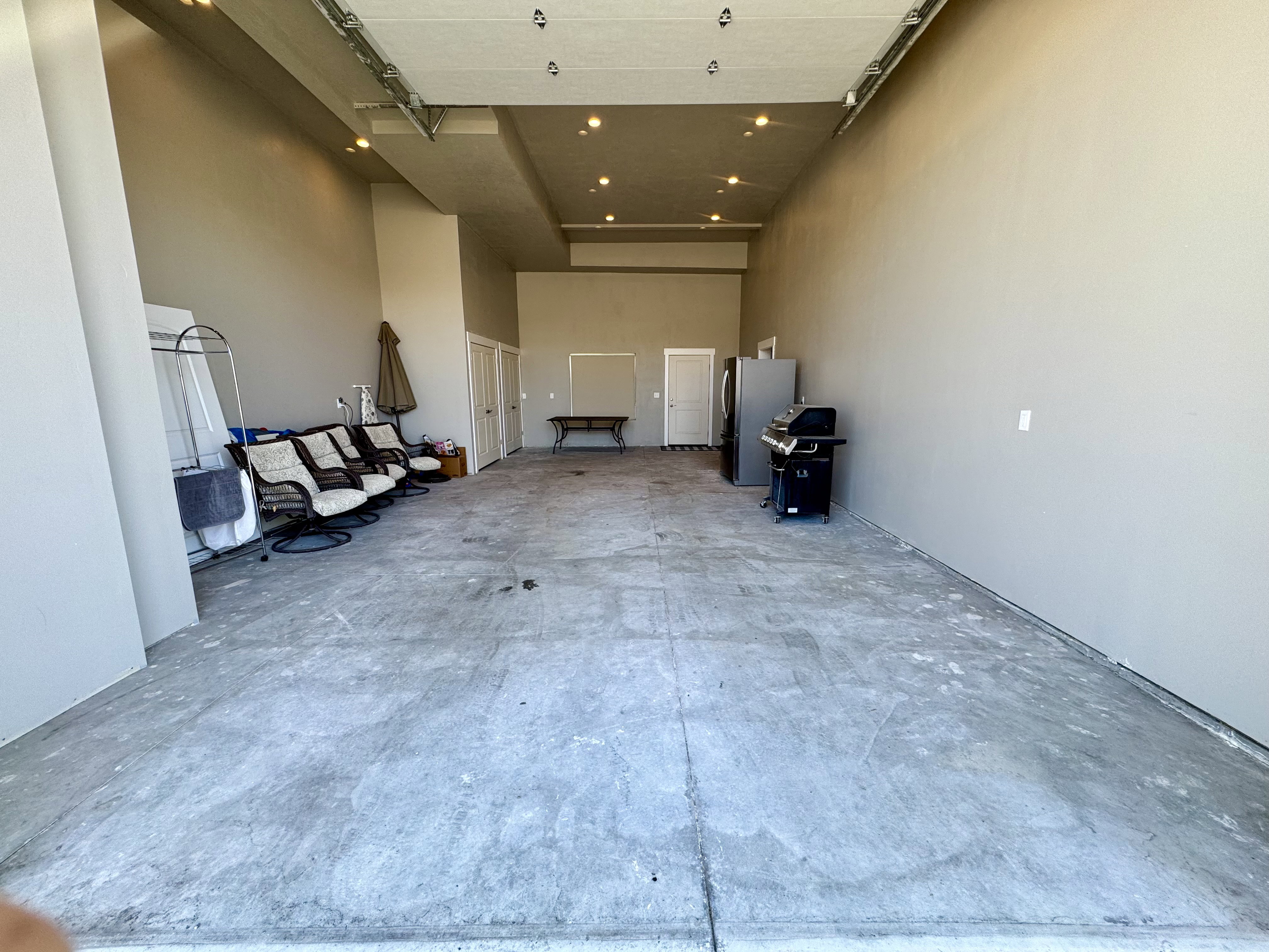 Garage with freestanding refrigerator