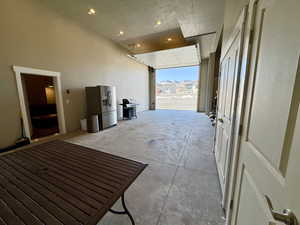Garage with oversized 14' door laundry room for all your toys, can be also used for an additional entertaining area