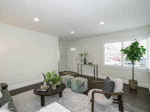 Living room with recessed lighting, baseboards, and wood finished floors