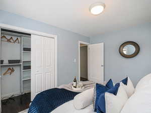 Bedroom featuring a closet and wood finished floors