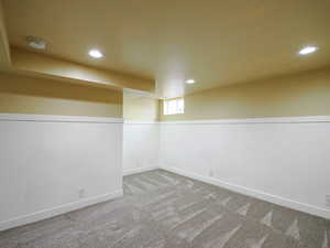 Basement featuring recessed lighting and carpet floors