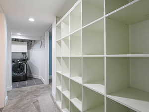 Interior space with washer / clothes dryer and carpet floors