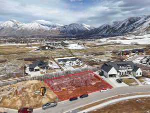 Snowy aerial view with a mountain view