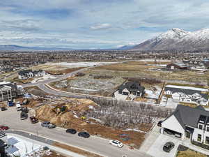 Birds eye view of property featuring a mountain view and a residential view