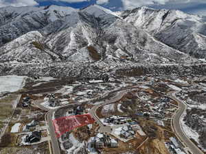 Snowy aerial view featuring a mountain view