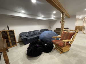 Interior space with beam ceiling, carpet flooring, recessed lighting, and visible vents
