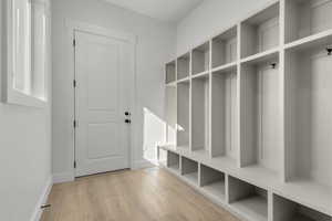 Mudroom with exterior entrance from front porch