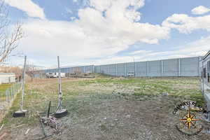 2 additional parcels part of the sale View of yard featuring fence