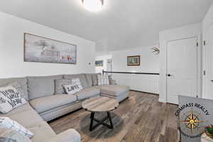 Living room featuring wood finished floors