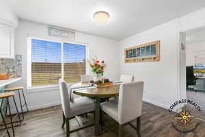 Dining area featuring wood finished floors and baseboards