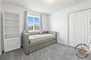 Bedroom 5 Carpeted bedroom featuring a closet and baseboards