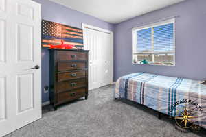 Bedroom 4 Carpeted bedroom with baseboards and a closet