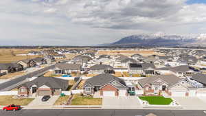 Birds eye view of property with a mountain view and a residential view