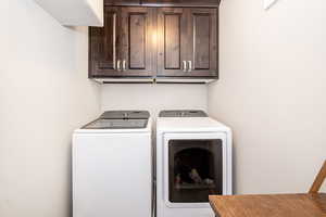 Clothes washing area with washing machine and dryer and cabinet space