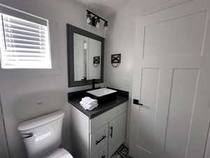 Bathroom with toilet and vanity