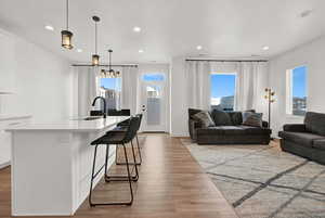 Living room featuring recessed lighting and light wood finished floors