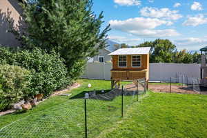 View of yard with an outbuilding and a fenced backyard