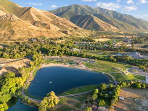Birds eye view of property featuring a water and mountain view