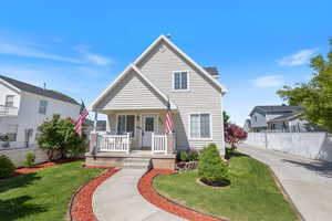 Traditional-style house featuring a porch