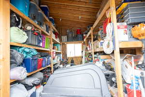 large storage shed on cement slab with built in shelves