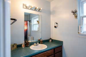 Full bath with toilet and vanity