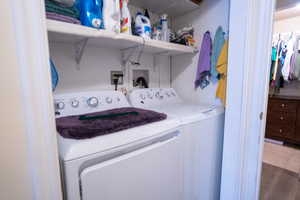 mother in law Washroom with laundry area and washing machine and dryer