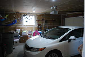 Garage featuring a garage door opener