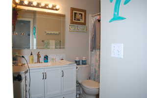 Bathroom featuring toilet and vanity