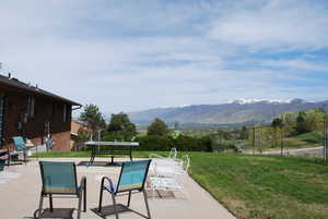 View of patio / terrace with a mountain view