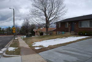 View of road with sidewalks and traffic signs