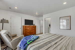 Bedroom with recessed lighting and visible vents
