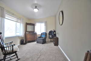 Living room with baseboards and carpet flooring.  Could be used as an office, piano room, visiting room or more...
