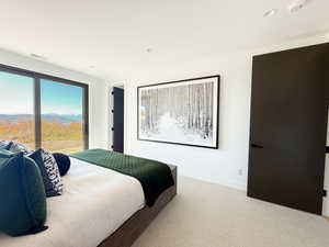 Carpeted bedroom featuring access to exterior, a mountain view, and recessed lighting