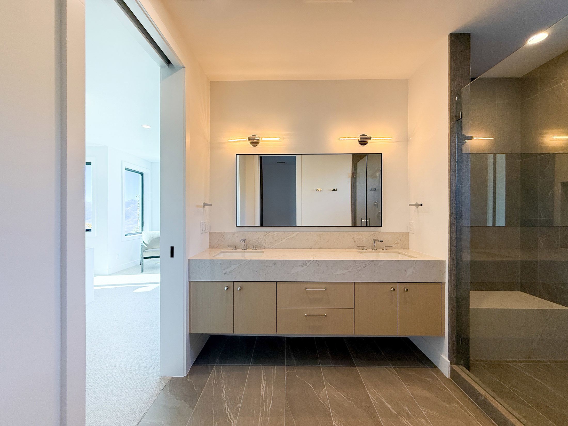 Full bath with double vanity, a stall shower, recessed lighting, and dark wood-style flooring