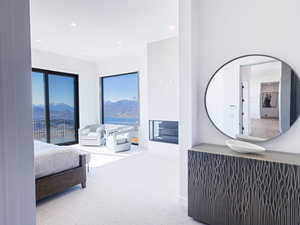 Bedroom with carpet floors, recessed lighting, and a mountain view