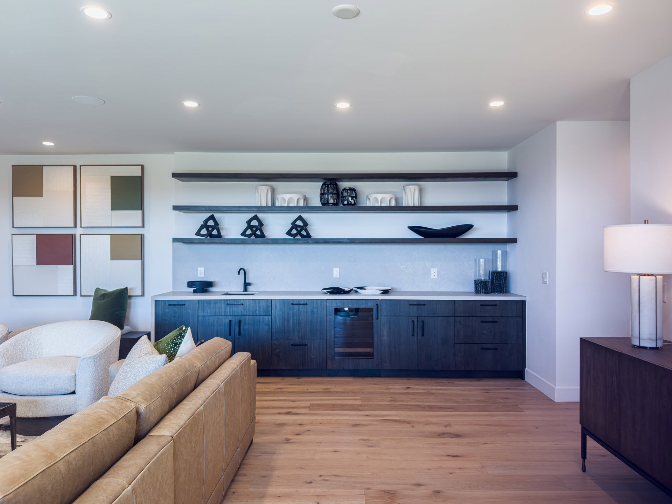 Bar area with open shelves, modern cabinets, light countertops, recessed lighting, and light wood-style flooring