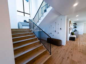 Stairs featuring wood-type flooring and baseboards