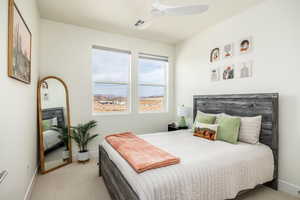 Bedroom with baseboards, visible vents, carpet floors, and ceiling fan