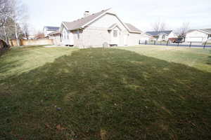 View of yard with a residential view and a fenced backyard