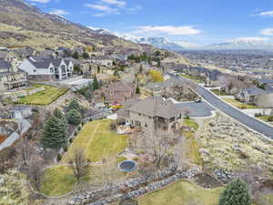 Birds eye view of property with a mountain view and a residential view