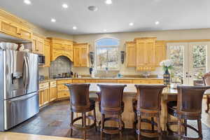 Kitchen featuring recessed lighting, decorative backsplash, appliances with stainless steel finishes, and a sink