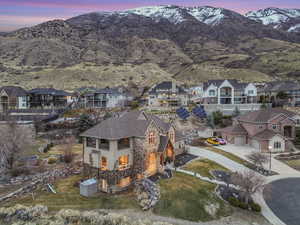 Aerial view at dusk with a residential view and a mountain view