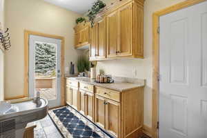 Mudroom with light countertops and a sink