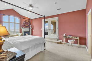 Carpeted bedroom with visible vents, baseboards, vaulted ceiling, french doors, and access to outside